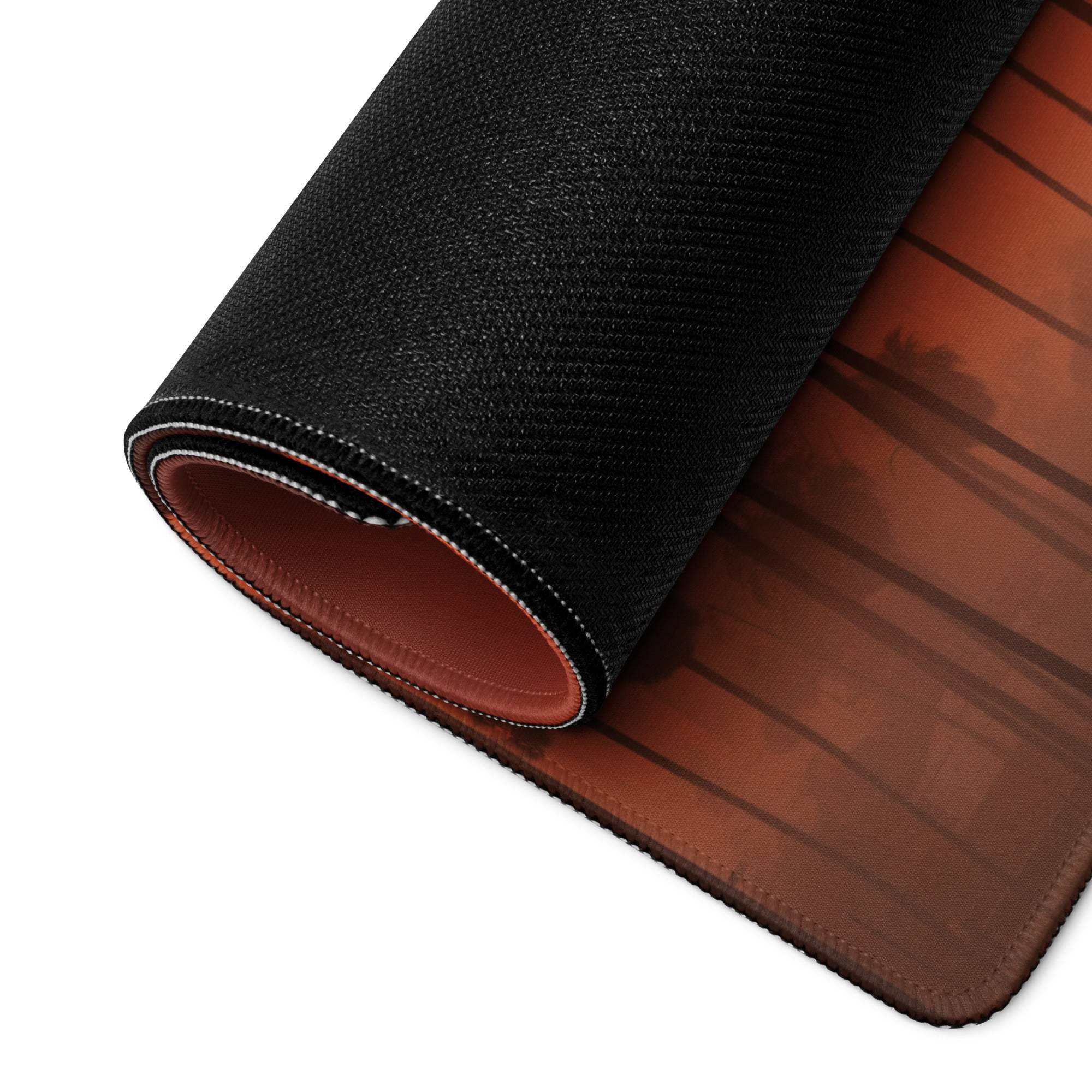 Black textured gaming mousepad back with brown leather-like underside