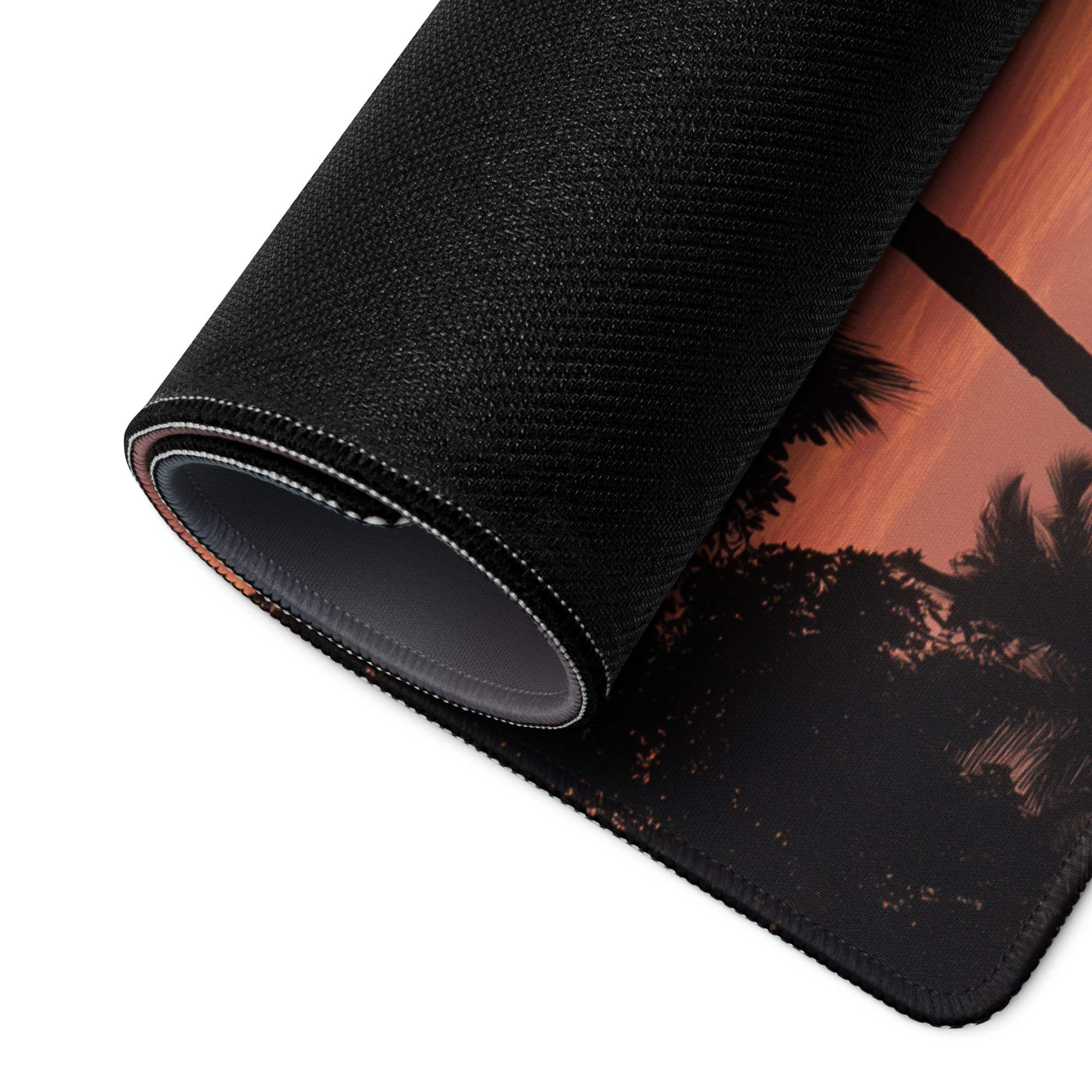 Black textured gaming mousepad with palm trees orange sunset, rolled edge