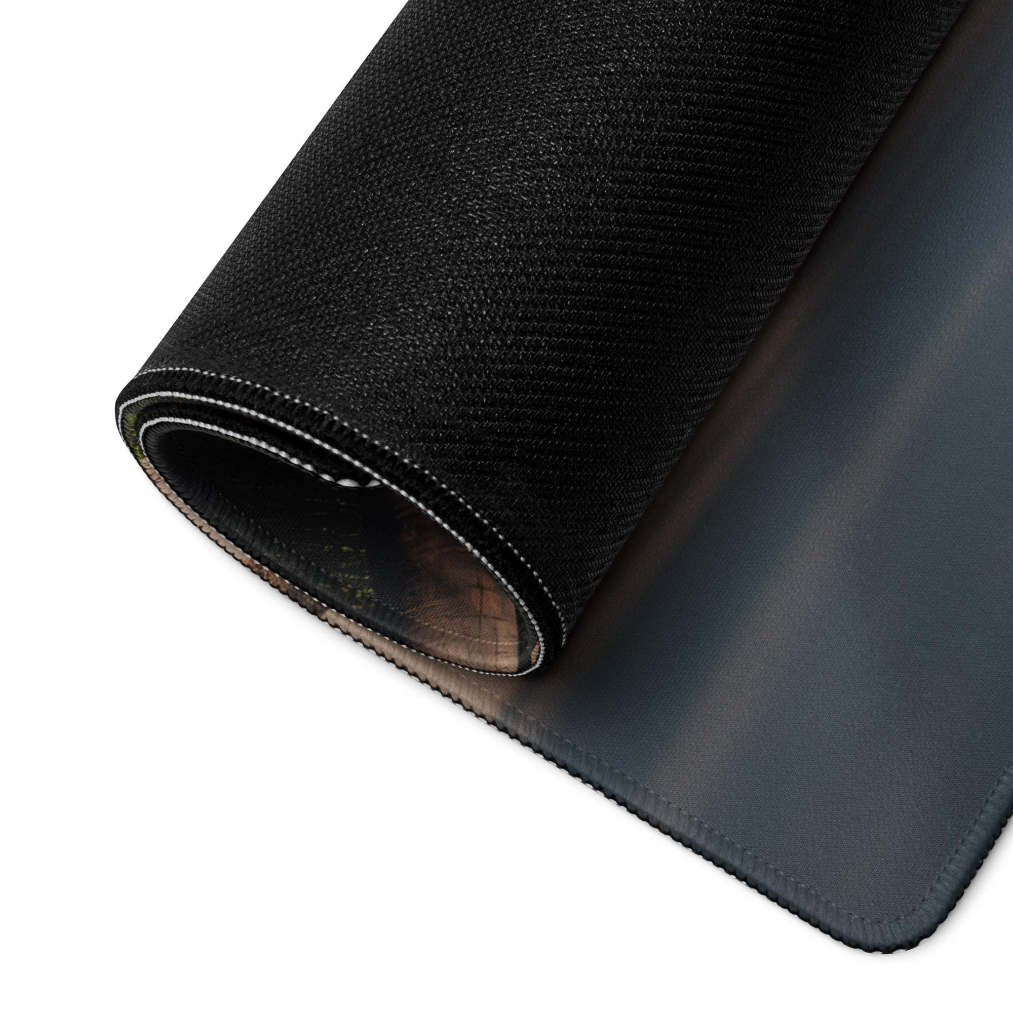 Back side of Vibrant Tropical Beach gaming mouse pad with black textured top, gray non-slip base and stitched edges