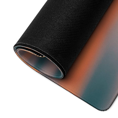 Rolled-up Premium Ocean Sunset gaming mouse pad with orange-to-teal gradient