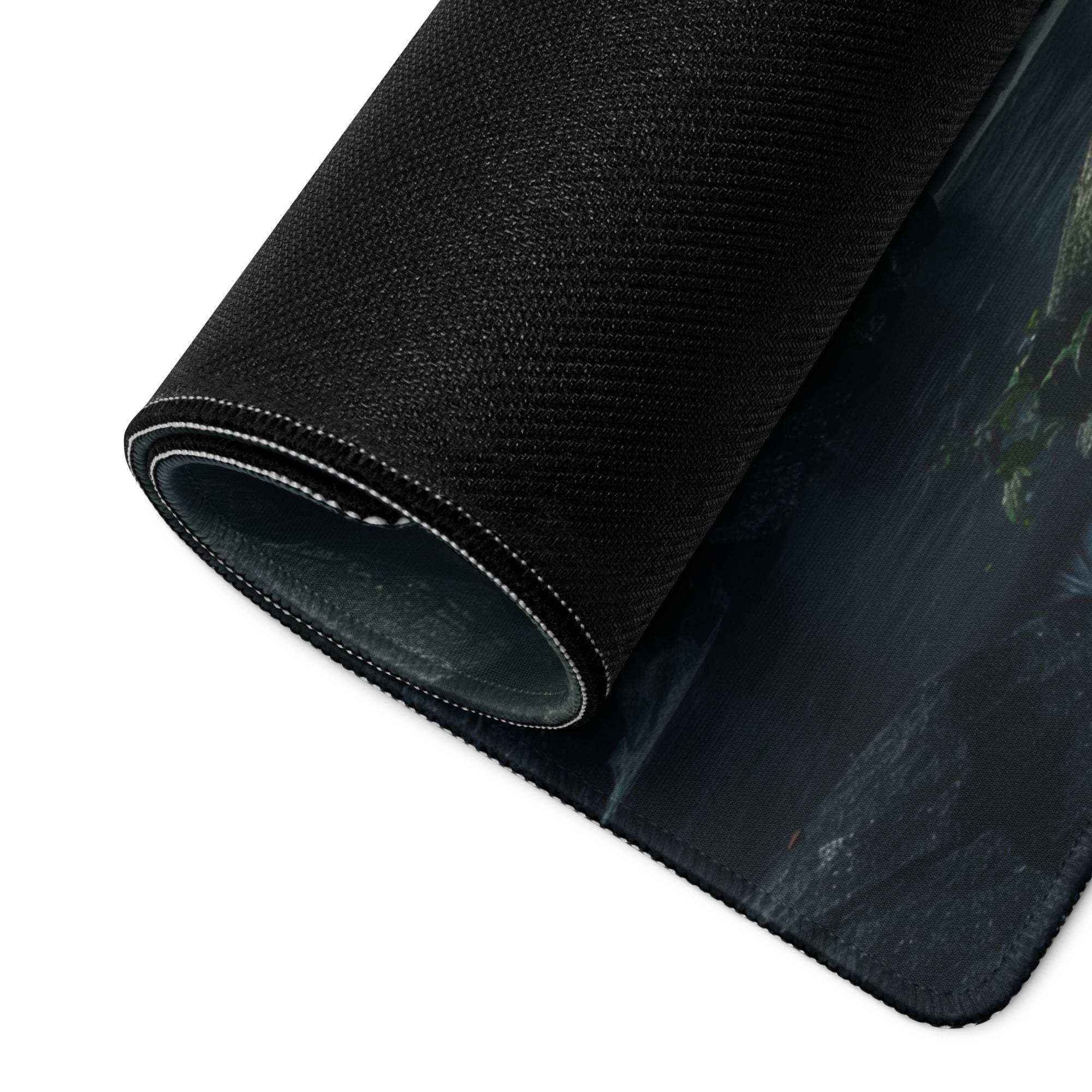 Black textured gaming mousepad with misty waterfall forest scene
