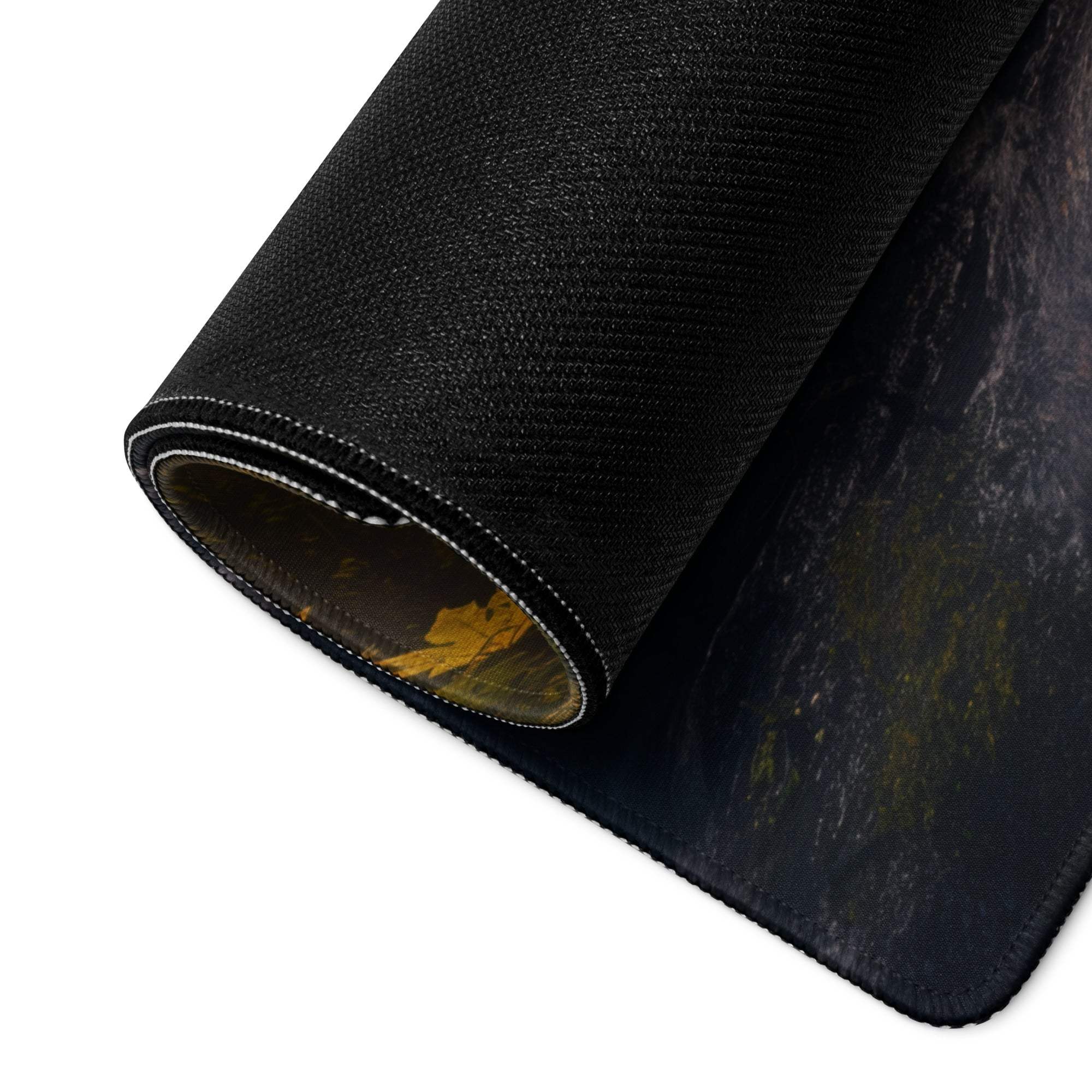 Back of Golden Hour Forest Waterfall gaming mouse pad with black textured non-slip underside and subtle golden leaf design