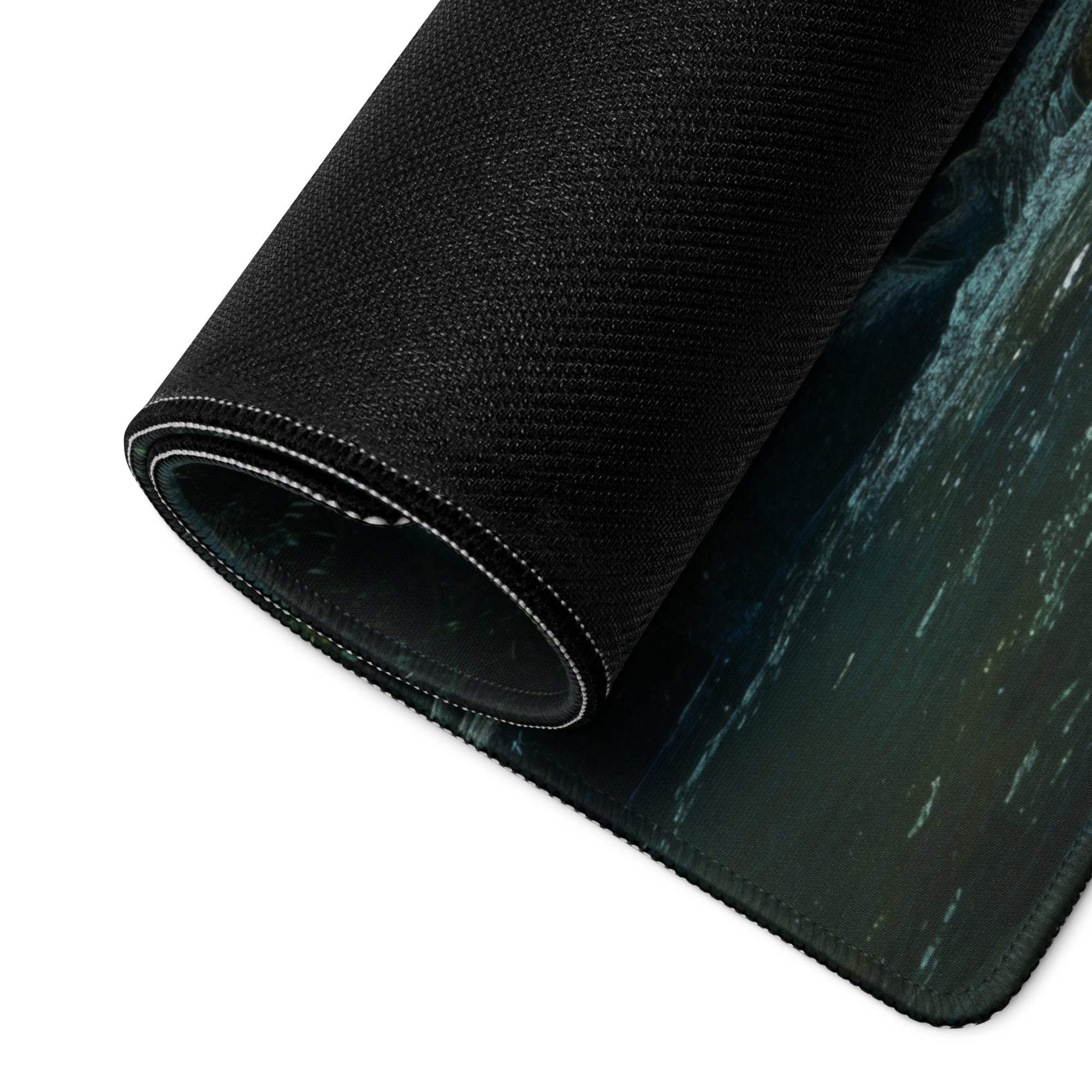 Black textured mousepad with teal ocean wave, white edge stitching