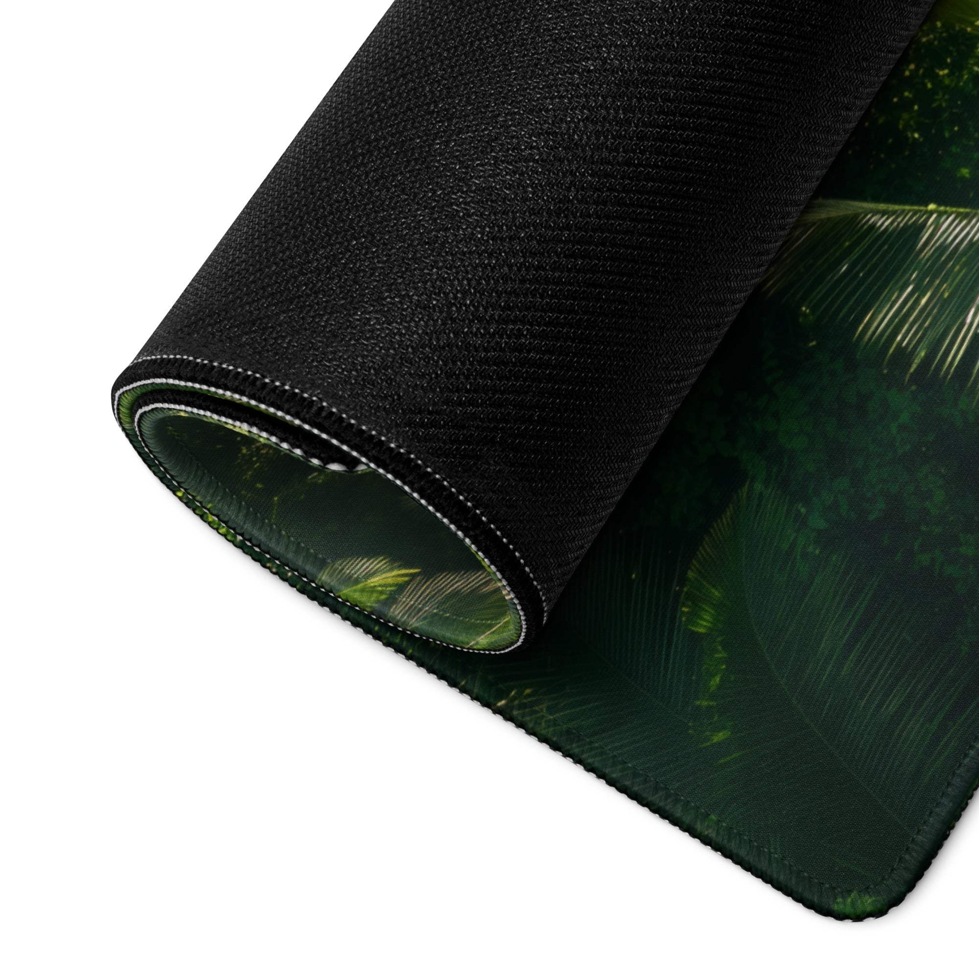 Black textured mousepad with vibrant green jungle waterfall leaf design
