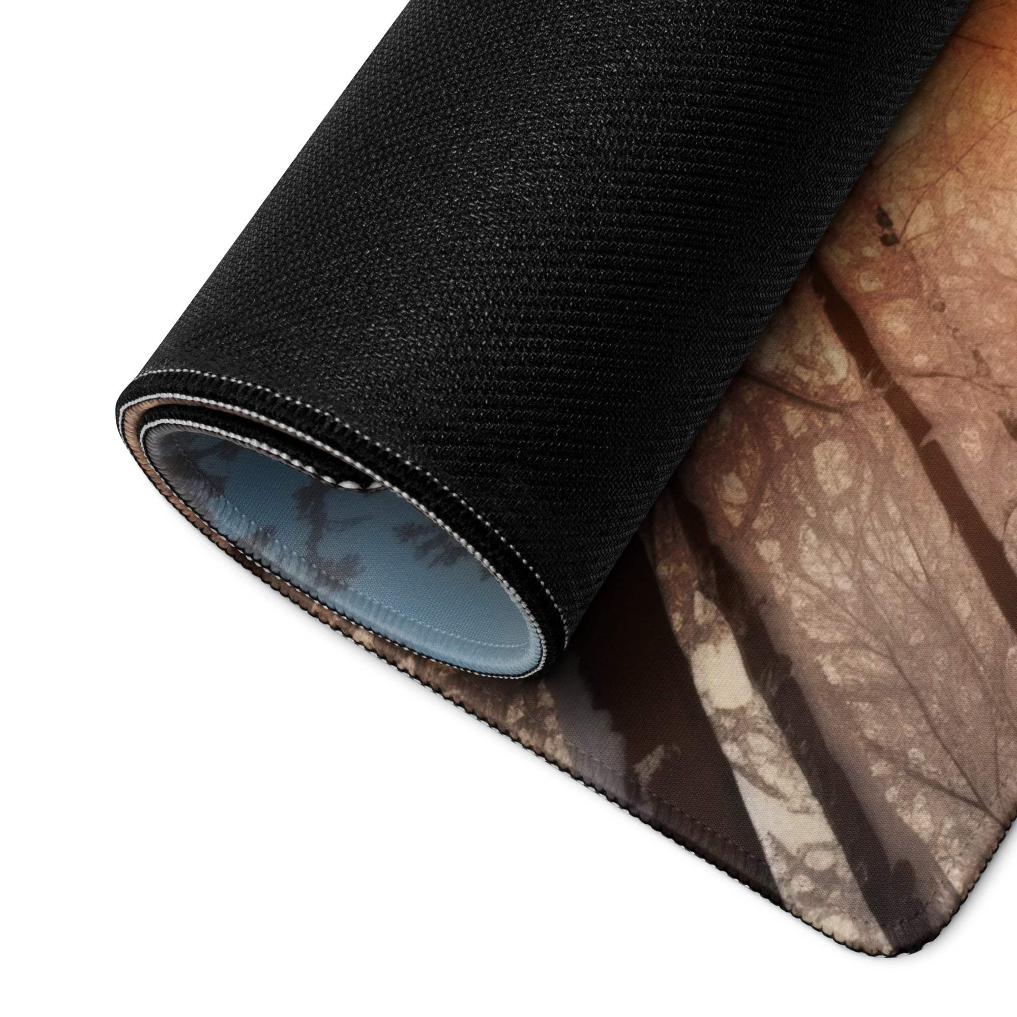 Forest Dawn warm orange glow large gaming mouse pad with black textured forest scene