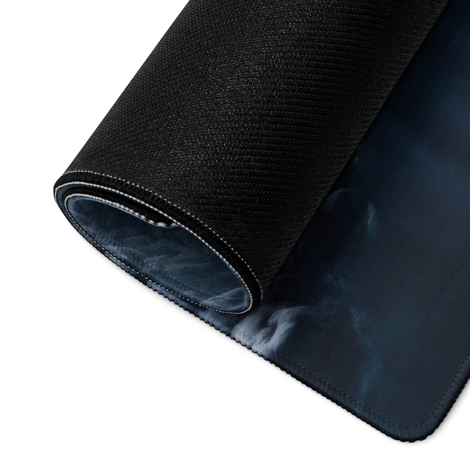 Black textured gaming mousepad with dark blue gradient and wintry blue forest design