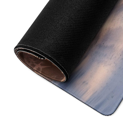 Black textured mousepad with blue-gray gradient and stitched edge, rolled view
