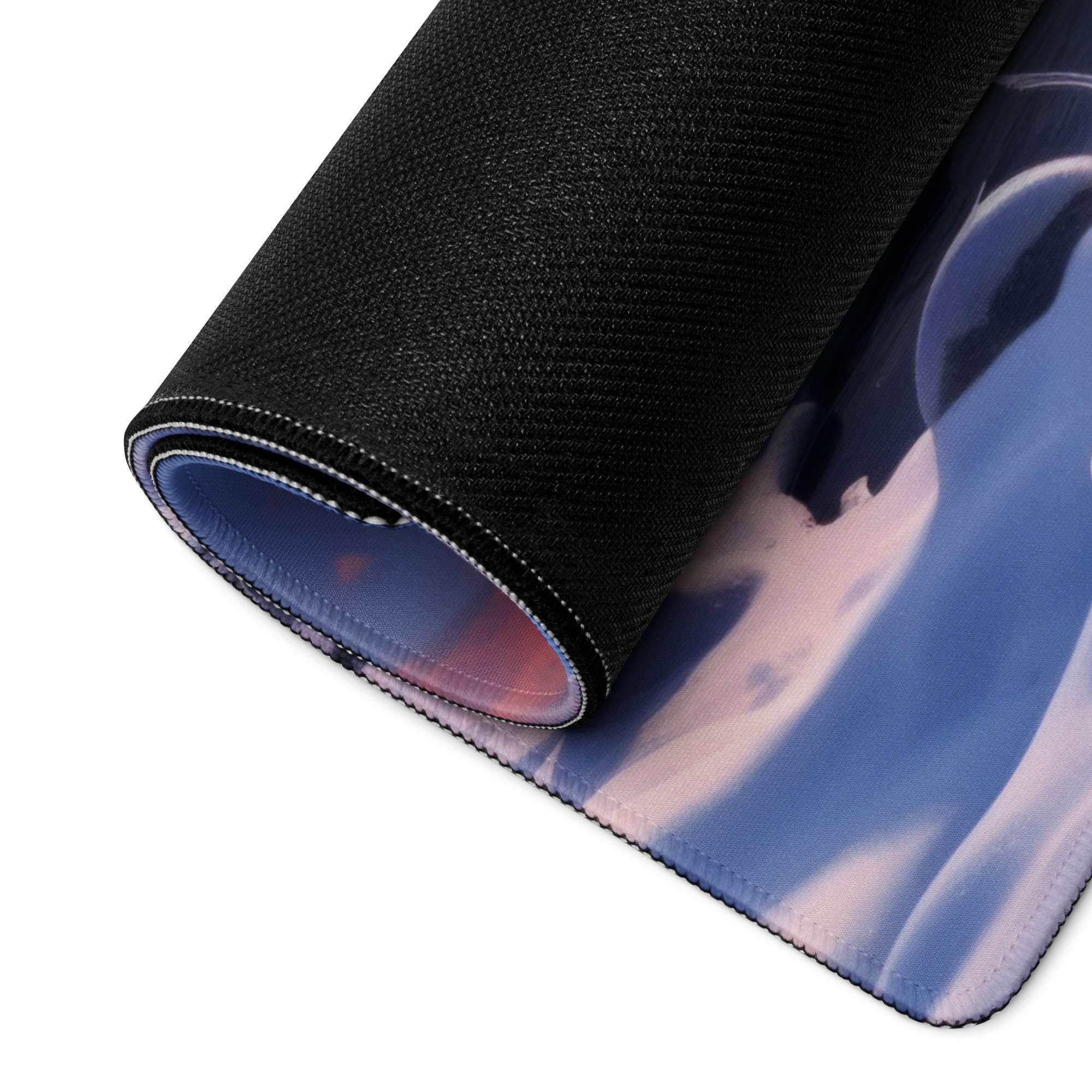 Rolled Epic Blue Winter Sunrise gaming mousepad with black texture