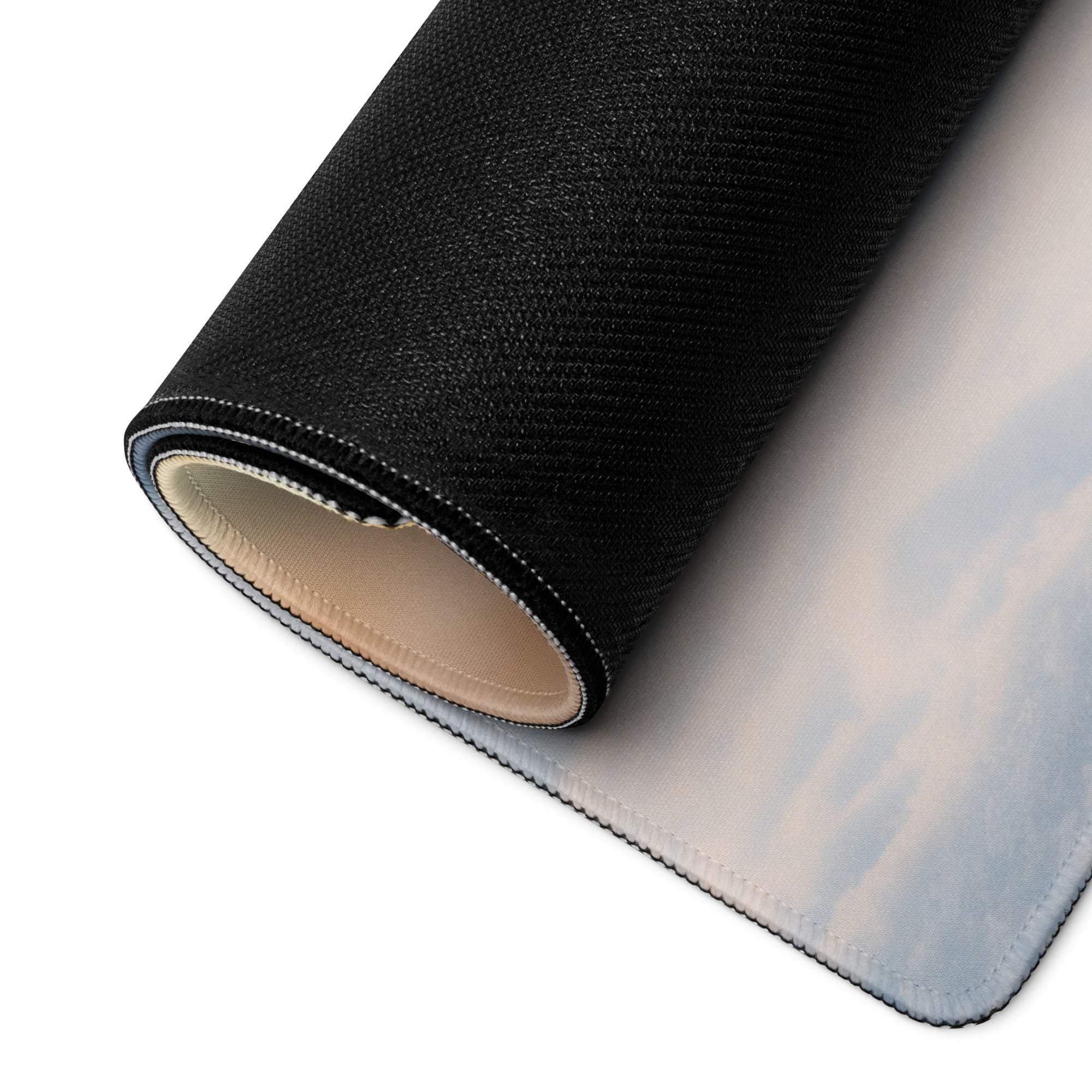 Black textured gaming mouse pad with sky clouds and snowman scene