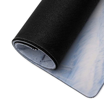 Back of Winter Blue Forest large gaming mousepad with black textured top and light blue white marble non-slip base plus stitched edges
