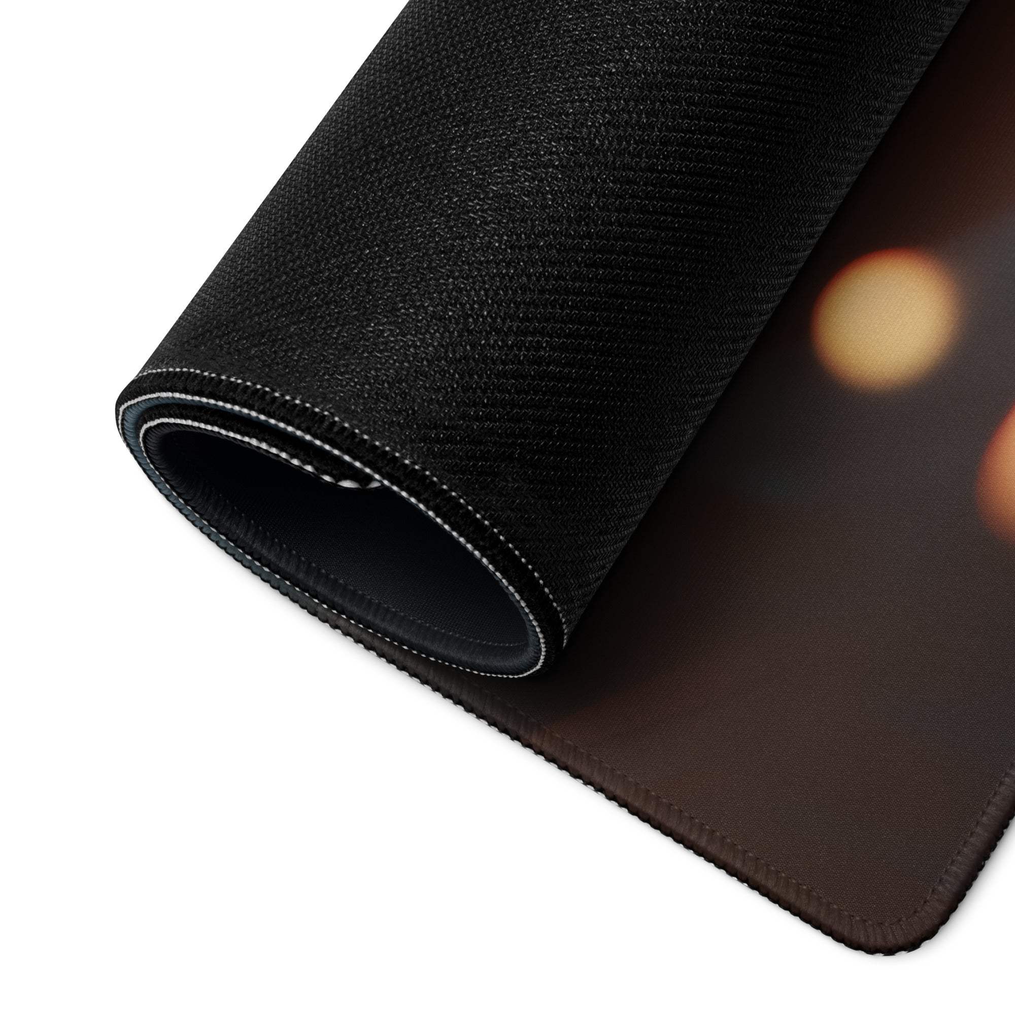 Moody Blue Bokeh Lights gaming mouse pad with black textured surface, rolled edge, white stitching, non-slip backing