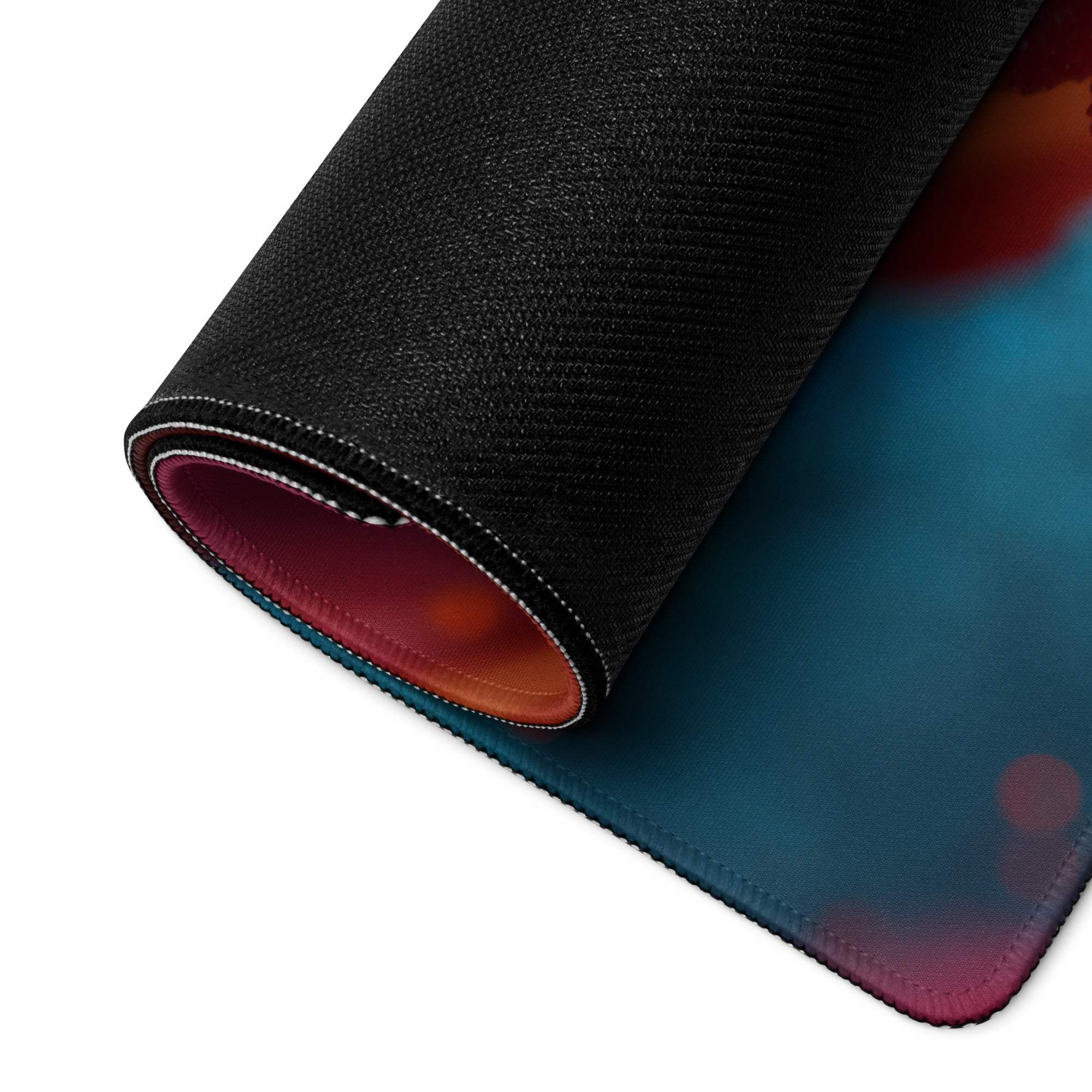 Vibrant neon abstract gaming mouse pad rolled up with gradient teal magenta orange design