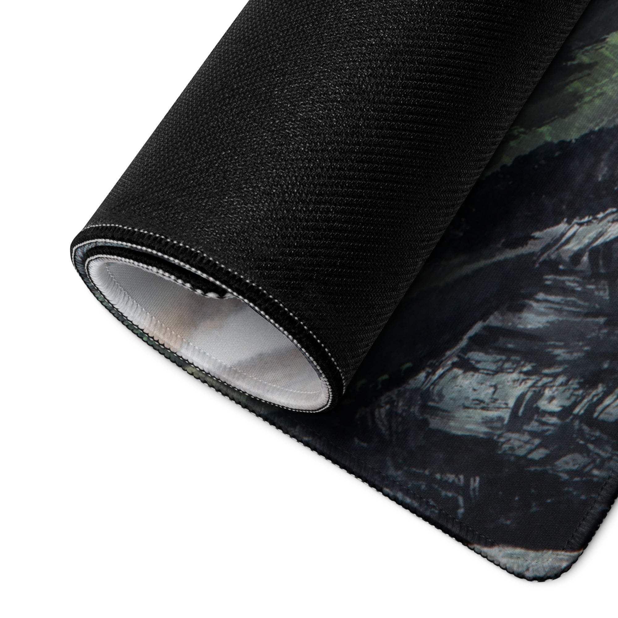 Black textured mist mountain gaming pad with dark moody gray green mountain landscape design for desk use