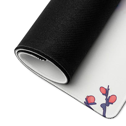 Black and white rolled mousepad with minimalist pink blossom floral design on purple stem for retro gaming desk use