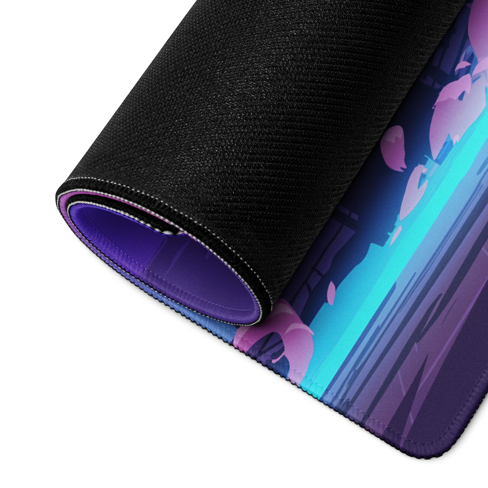 A rolled-up vaporwave neon city gaming mouse pad with vibrant pink teal anime design black textured surface and purple lining