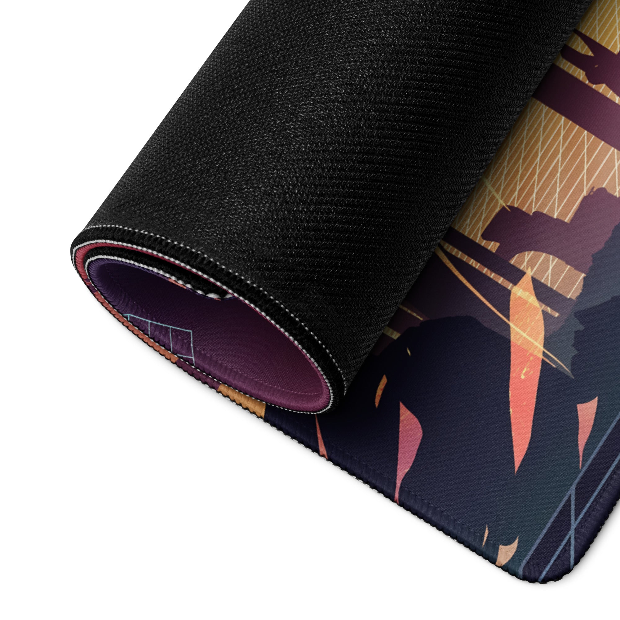 A rolled-up black gaming mousepad featuring a vaporwave sunset anime design with vibrant purple orange and gold colors