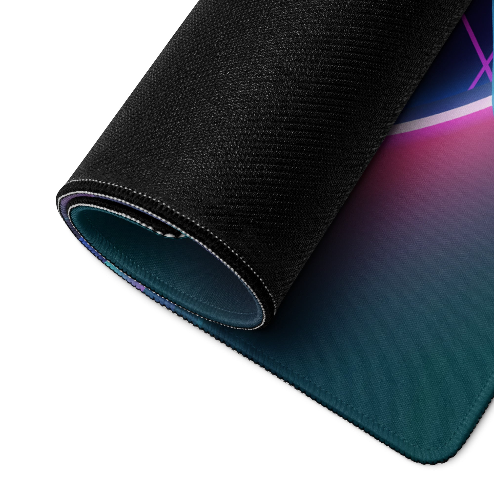 A rolled-up neon vaporwave gaming mouse pad with vibrant teal to purple gradient and black textured edge for gamers