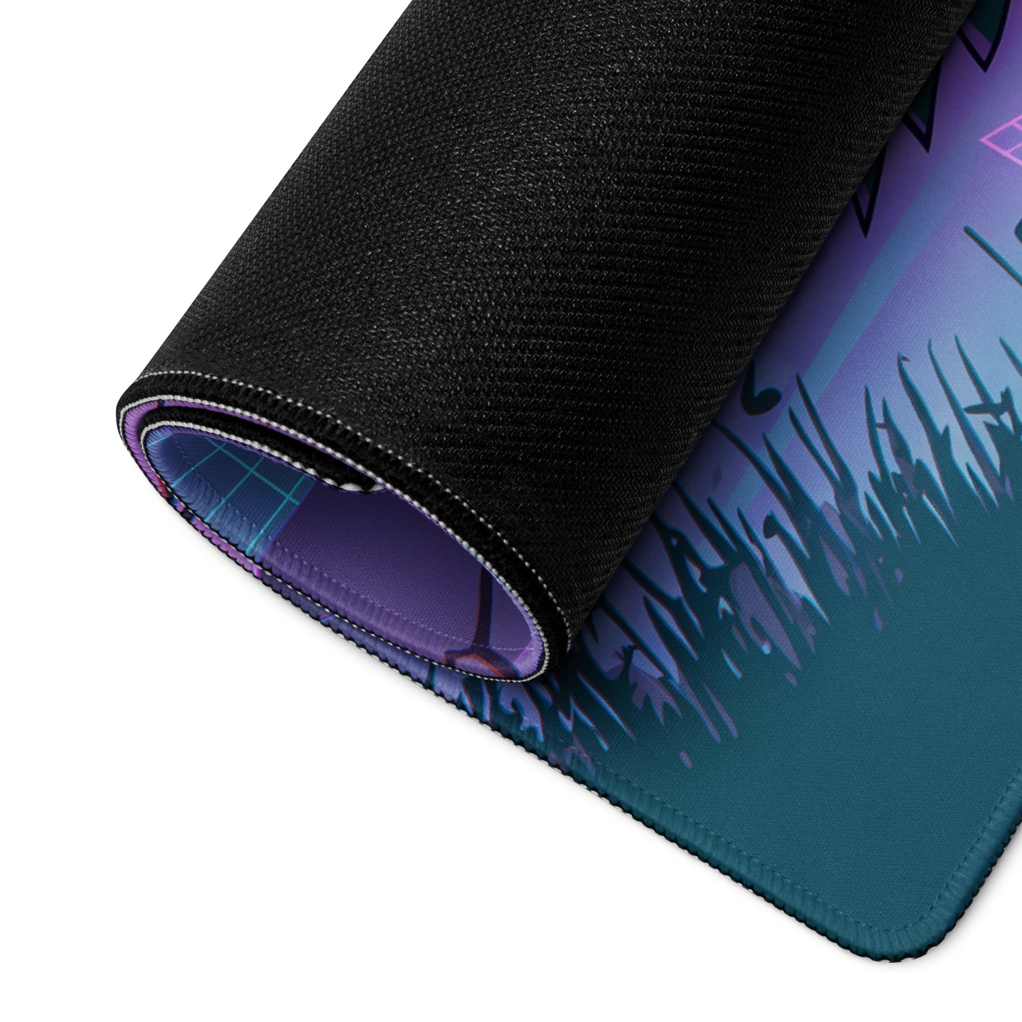 A rolled-up neon vaporwave cityscape gaming mouse pad with vibrant purple to teal gradient and black fabric edges