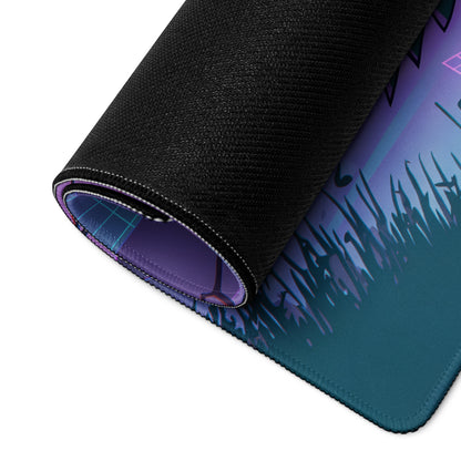 A rolled-up neon vaporwave cityscape gaming mouse pad with vibrant purple to teal gradient and black fabric edges