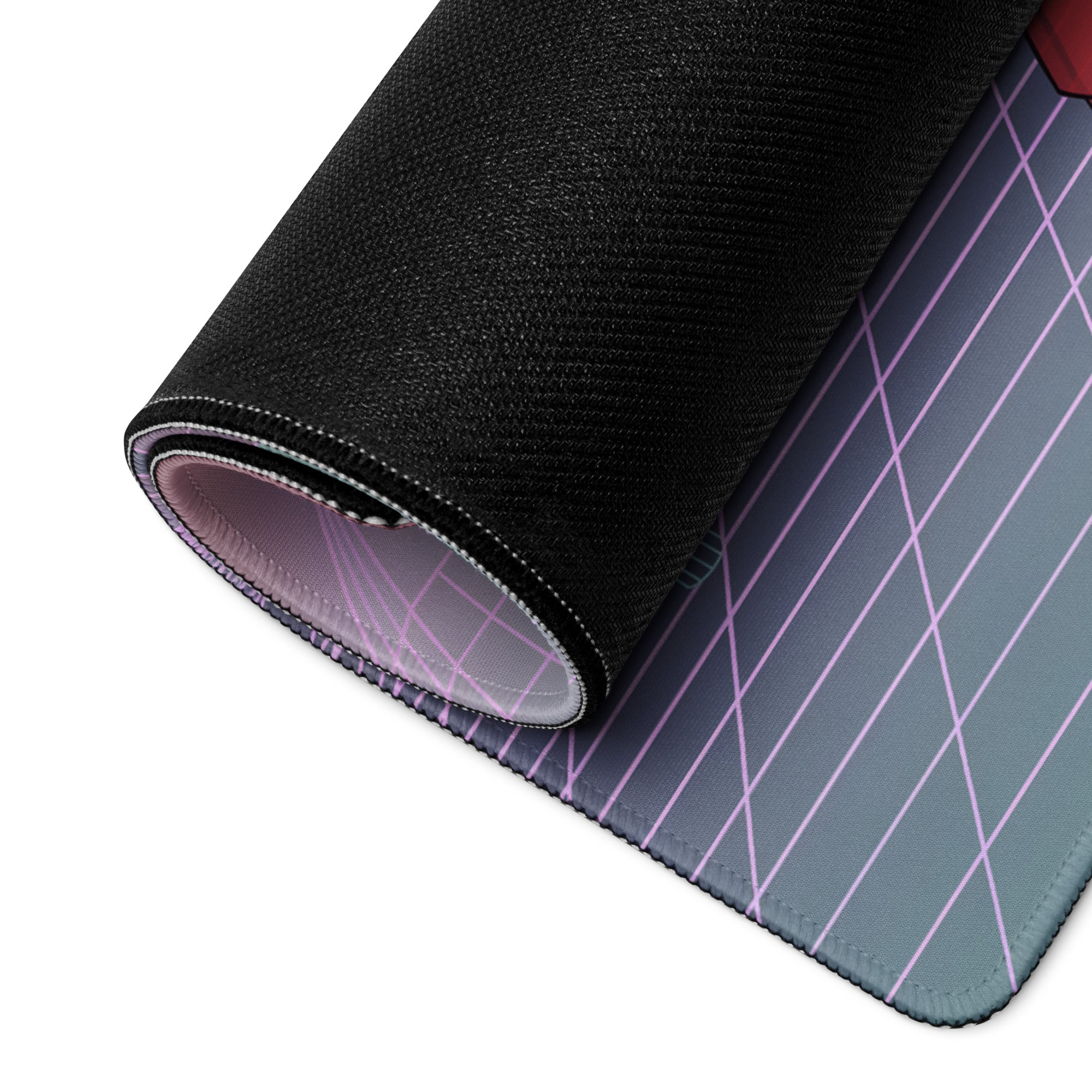 Rolled-up vaporwave neon desk pad with black textured edge and purple diagonal lines on gradient gray gaming mousepad