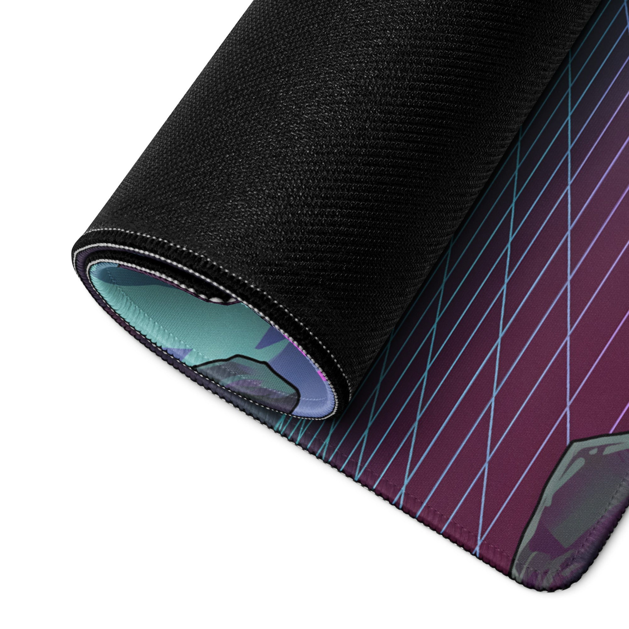 Rolled-up vaporwave neon gaming desk mat with black textured outer layer and purple teal blue diagonal inner design