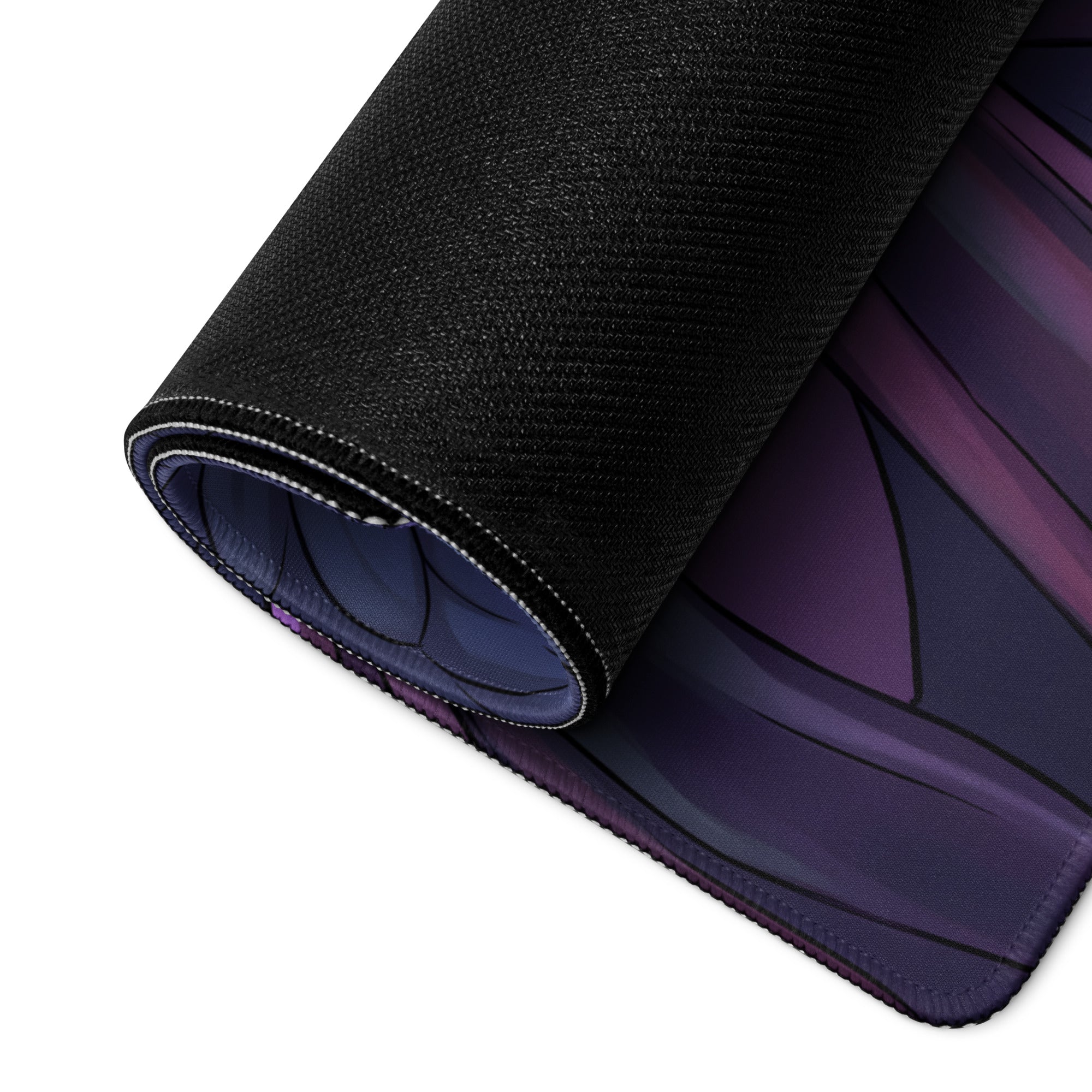 A rolled-up black gaming mouse pad featuring a vibrant purple and dark blue neon angel vaporwave anime design