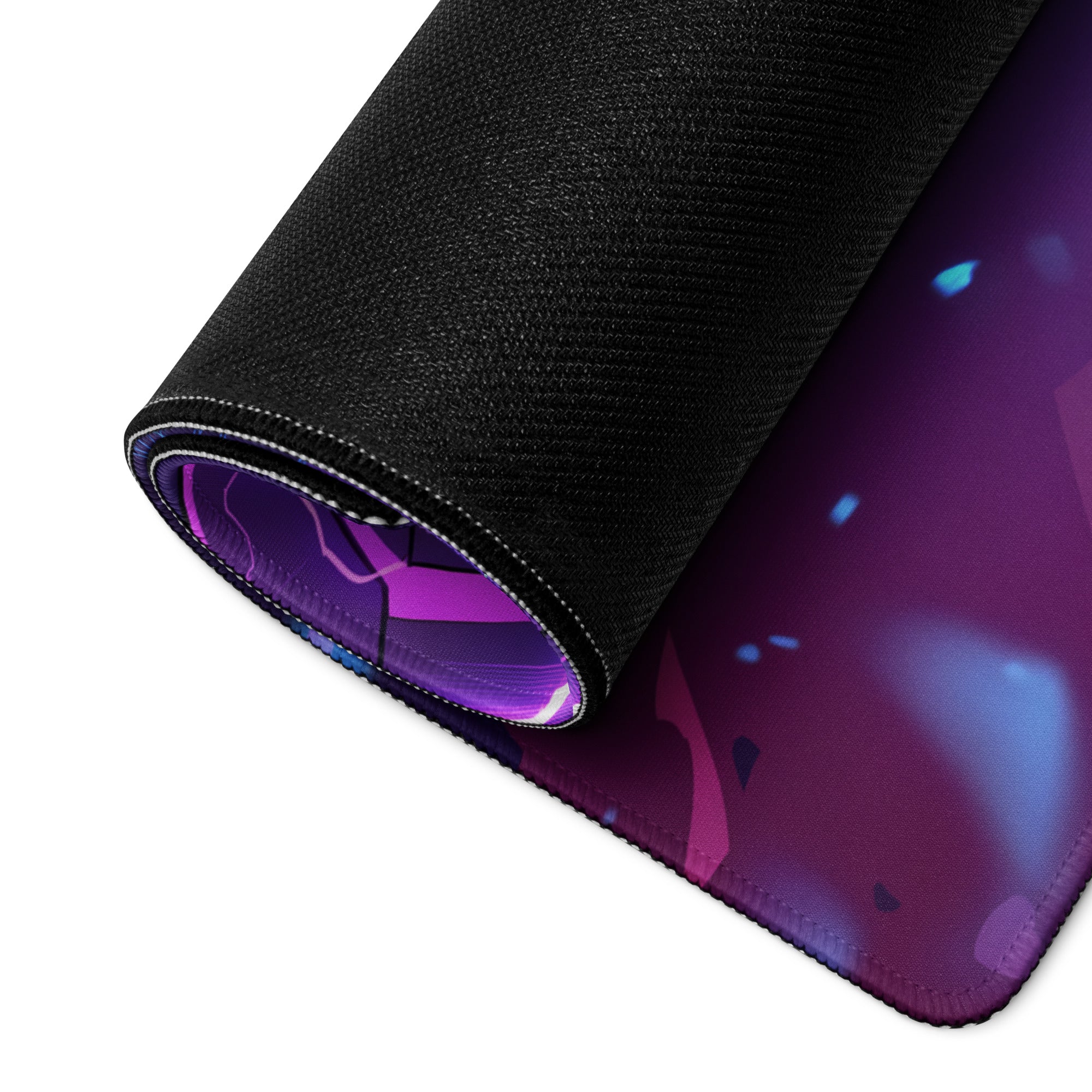 A rolled-up neon vaporwave combat gaming mousepad with vibrant purple blue cosmic design and black fabric edges