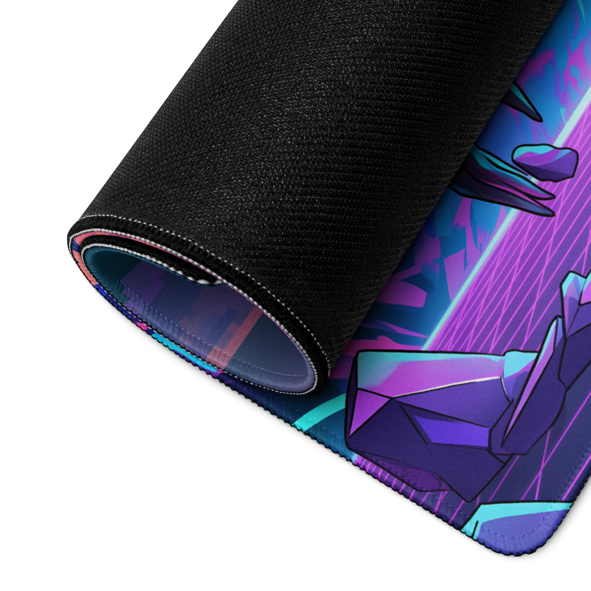 A rolled-up neon vaporwave skull mouse pad with vibrant purple pink and cyan geometric design for desk setup