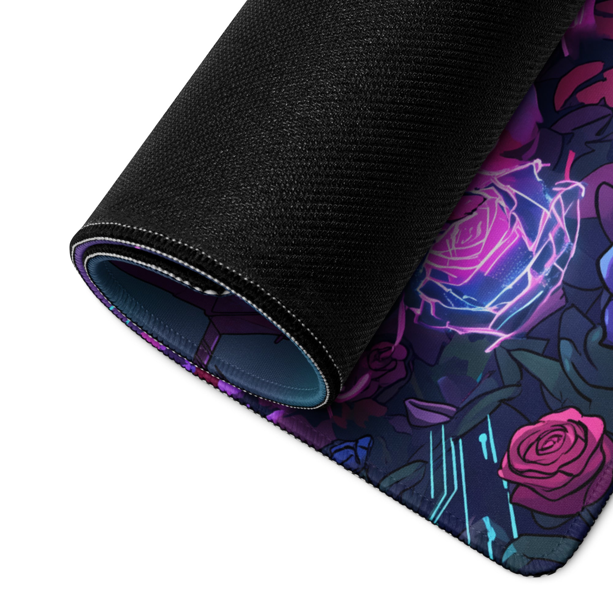 Rolled-up black gaming mousepad with vibrant neon rose design in purple pink and blue for vaporwave desk setup