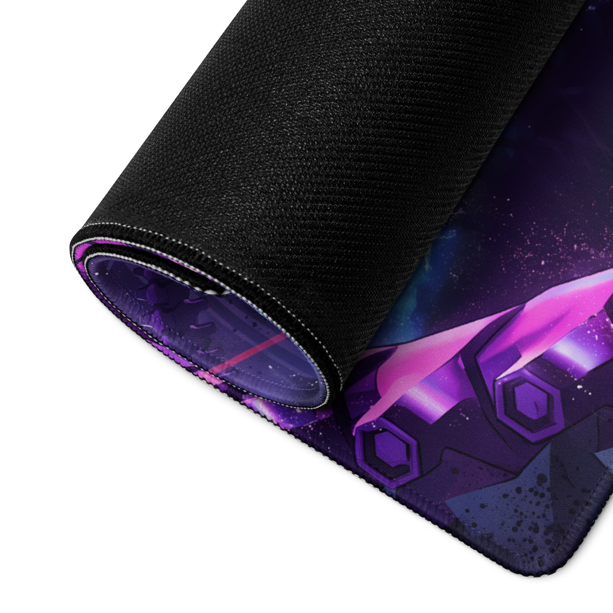 A rolled-up vaporwave neon night gaming mouse pad with purple blue cosmic design and black fabric border for desk setup