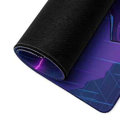 A rolled-up vaporwave neon desk mat with vibrant purple blue cosmic design and black stitched fabric edges