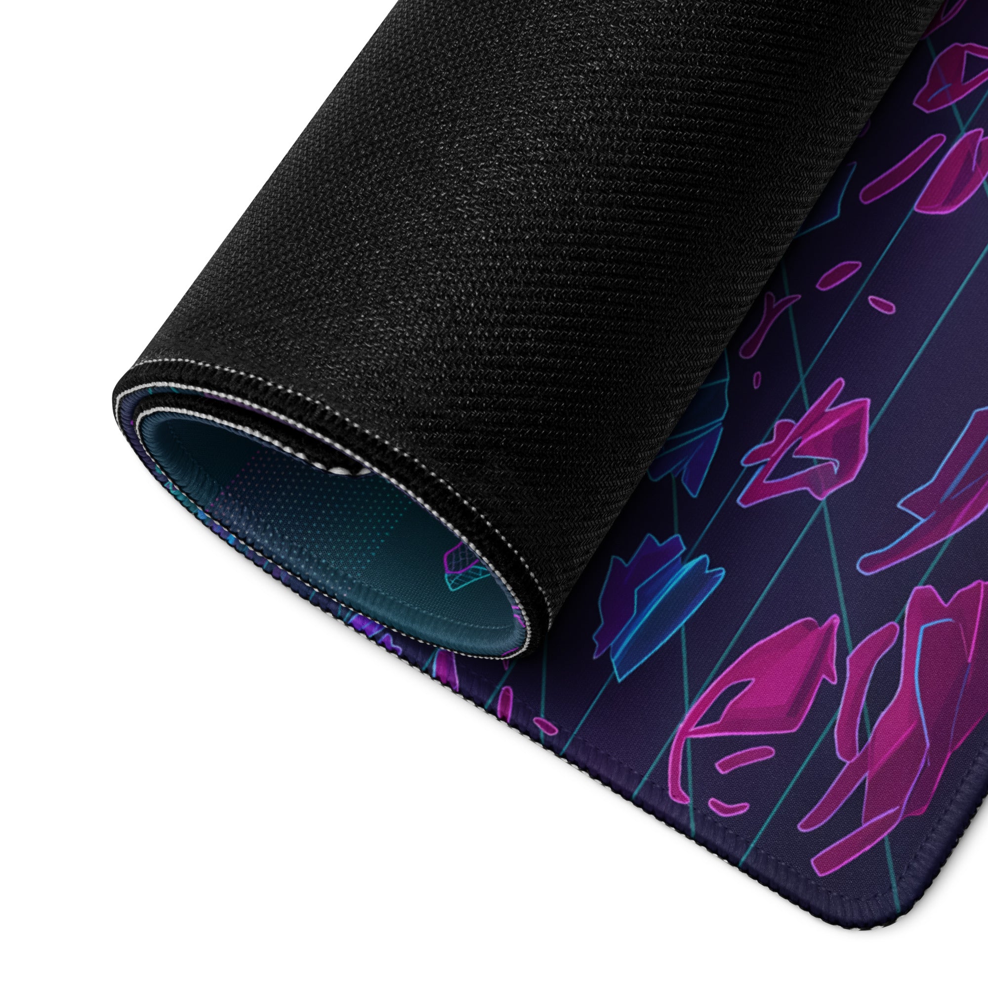 A rolled-up black gaming mousepad with neon purple and teal geometric vaporwave nightscape design