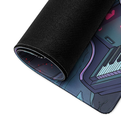 A rolled-up black gaming mouse pad with a neon vaporwave anime-inspired piano design in purple and teal accents