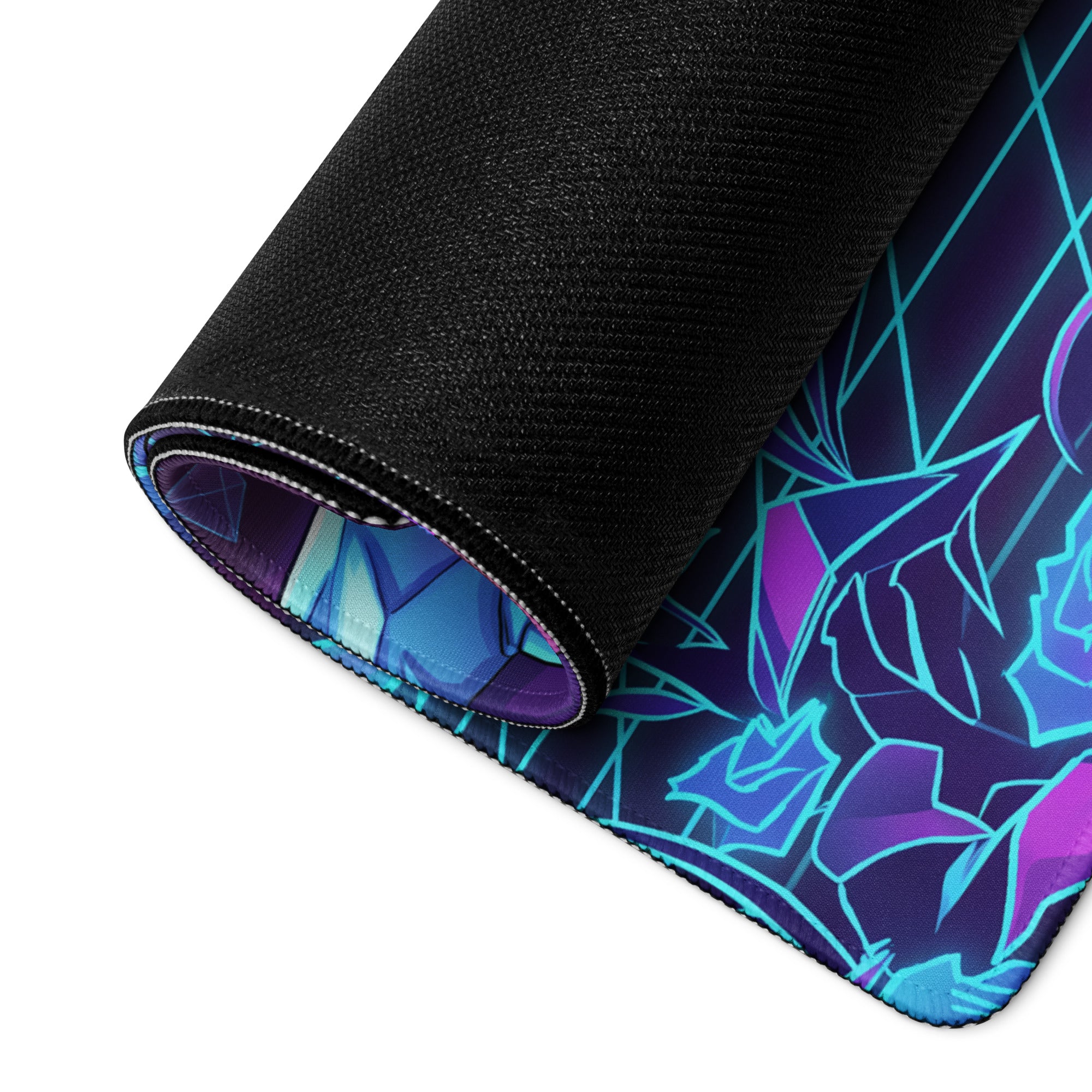A rolled-up vaporwave neon dragon gaming mousepad with vibrant purple and cyan geometric design on black fabric