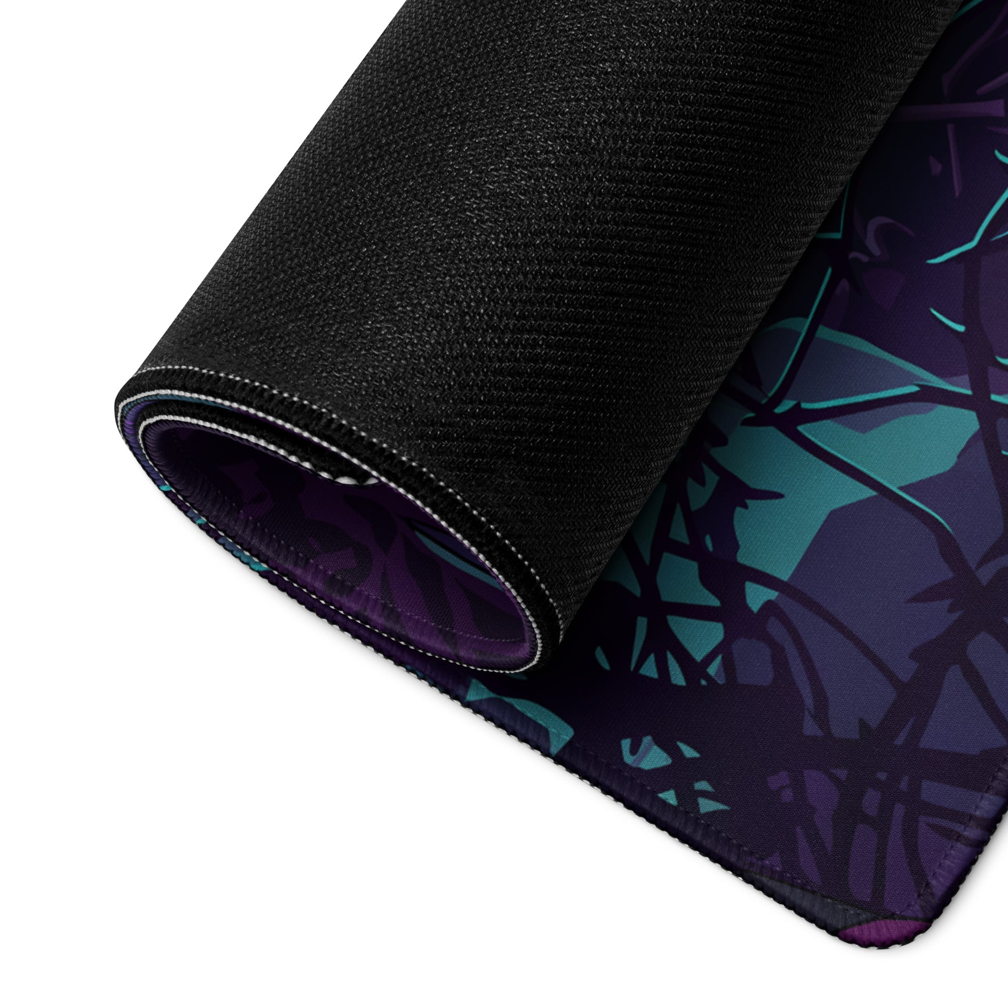 Black textured vaporwave jungle mouse pad with rolled edge featuring teal and purple abstract vine design for gaming