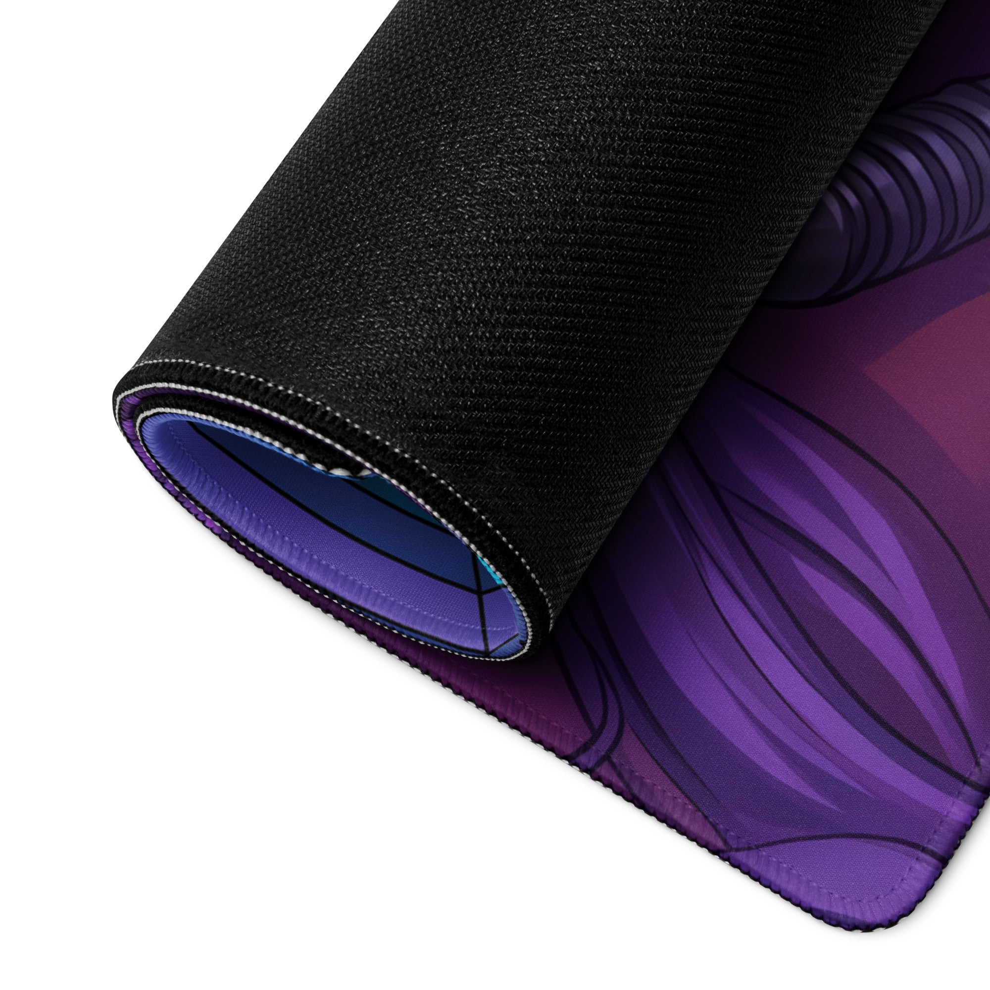A rolled-up black gaming mouse pad with a vibrant purple anime-style vaporwave neon predator design