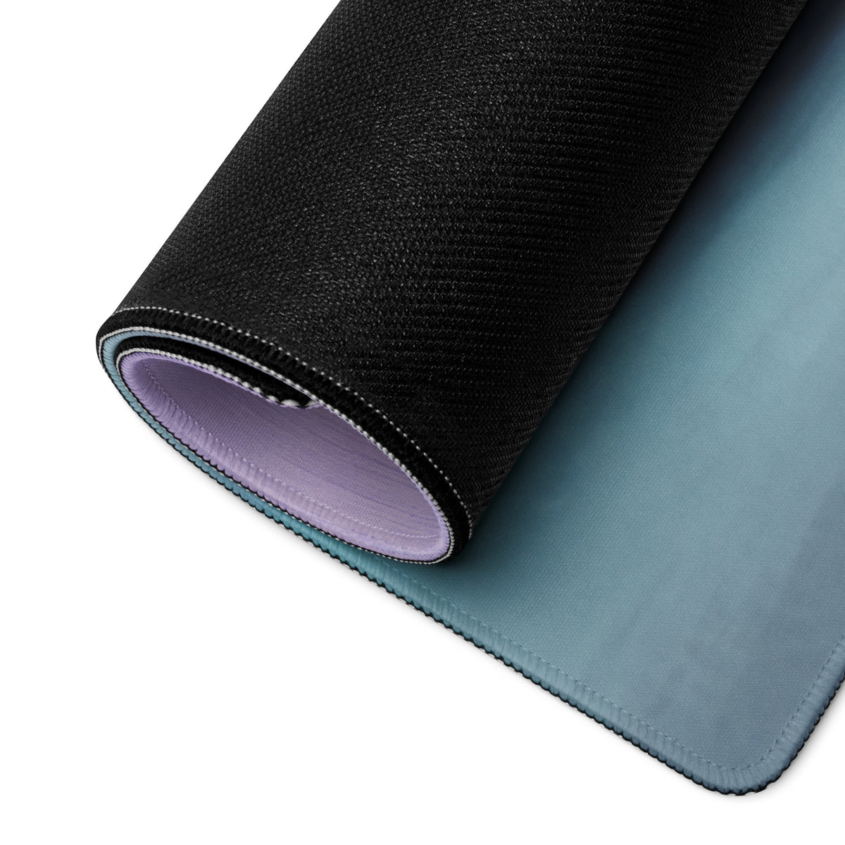 Ferrari 488 gt3 inspired motorsport desk mat with black textured outer layer and soft lavender inner lining rolled to show design