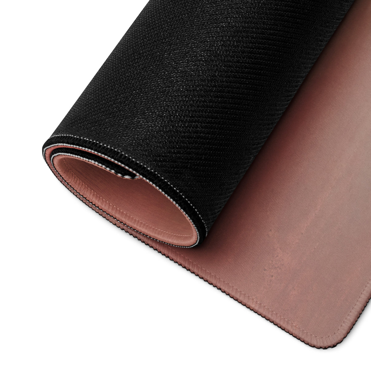 Porsche 911 gt3 inspired sky blue desk mat with black textured outer layer and soft rose gold inner lining rolled neatly