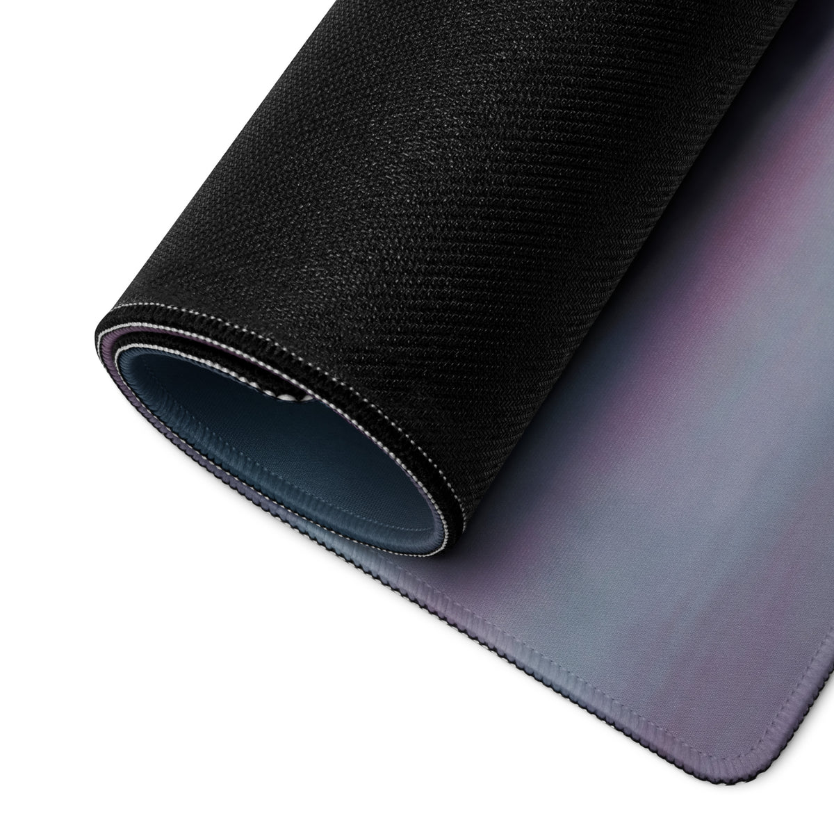 Black textured McLaren Senna inspired apex stealth desk pad with gradient purple gray surface and stitched edges