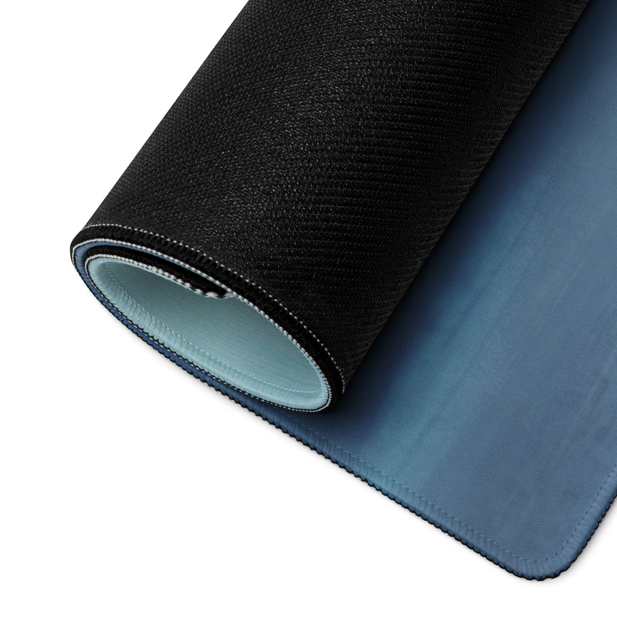 Mclaren 720s gt3 inspired stealth orange desk mat with low friction cloth black textured outer layer and soft blue interior
