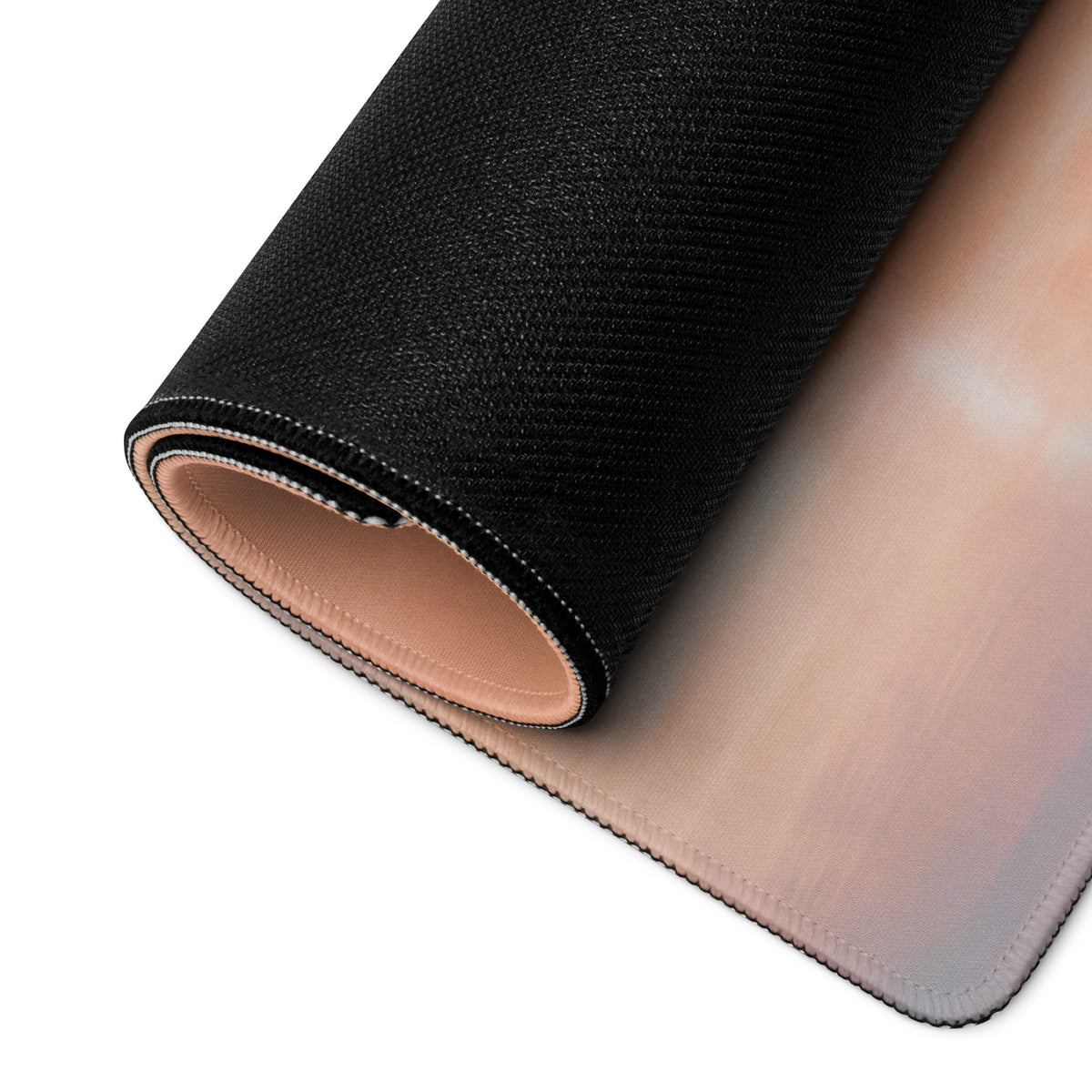 Black textured mcLaren P1 inspired solar flare desk mat with soft beige underside and stitched edges for low friction use