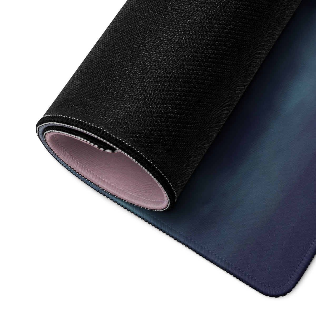Lamborghini countach inspired pearl bronze desk pad with black textured surface and gradient blue underside with pink lining
