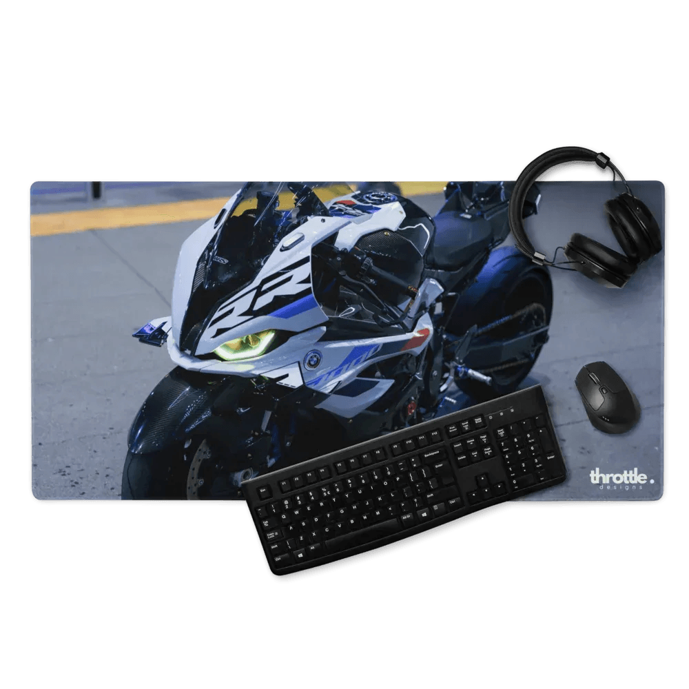 Black keyboard and mouse on large bmw inspired s1000rr gaming mouse pad with white blue and black motorcycle design