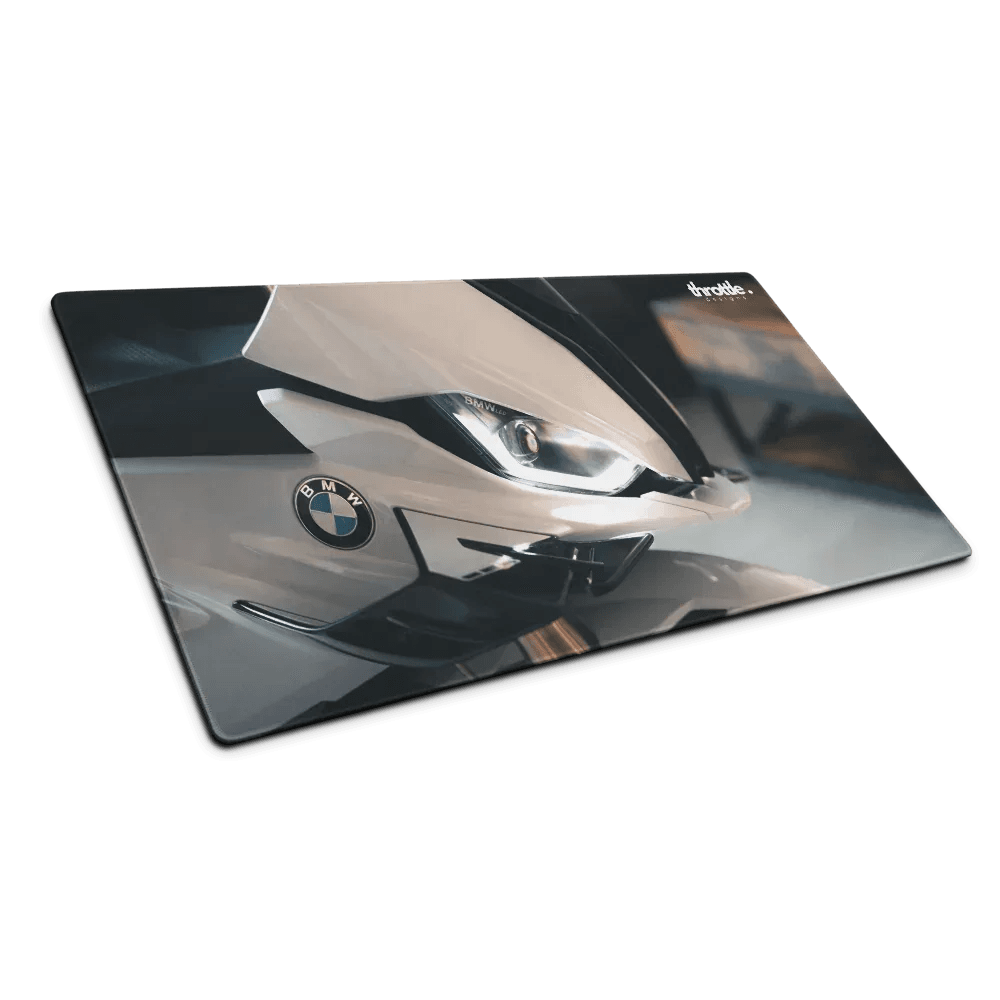 A sleek glossy rectangular gaming mouse pad featuring a white bmw s1000rr front end with led headlights and logo