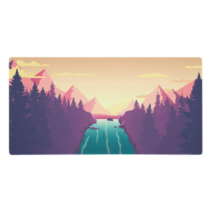 Pastel sunset mountain desk pad with purple and pink peaks teal waterways and evergreen trees under orange sky