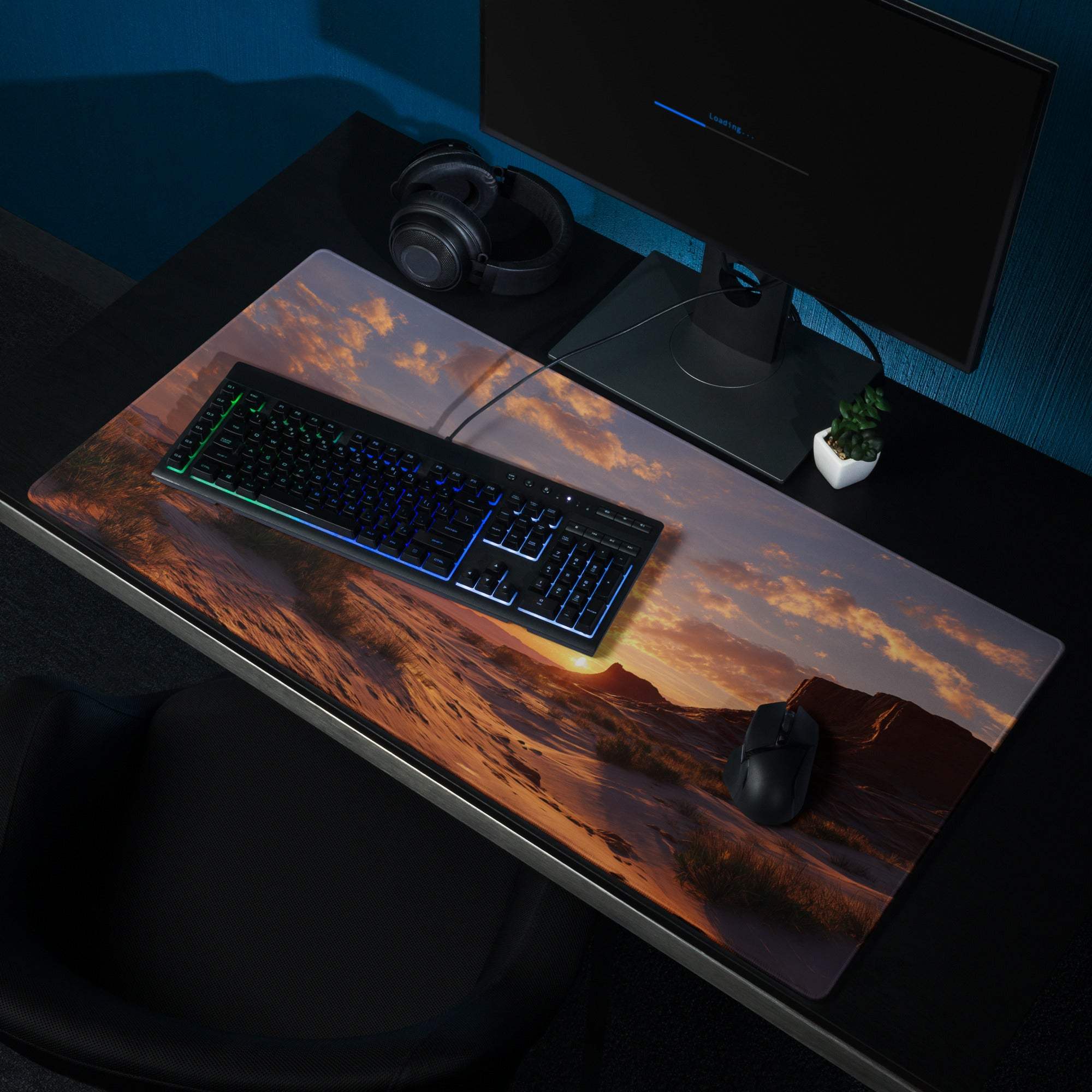 Large cinematic gaming mousepad with warm orange purple desert sunset over mountains