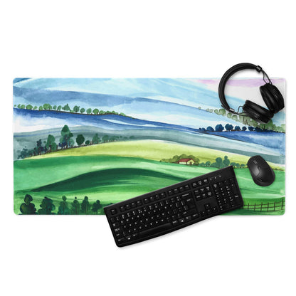 Large watercolor landscape gaming mouse pad with green hills, blue sky, non-slip stitched edges