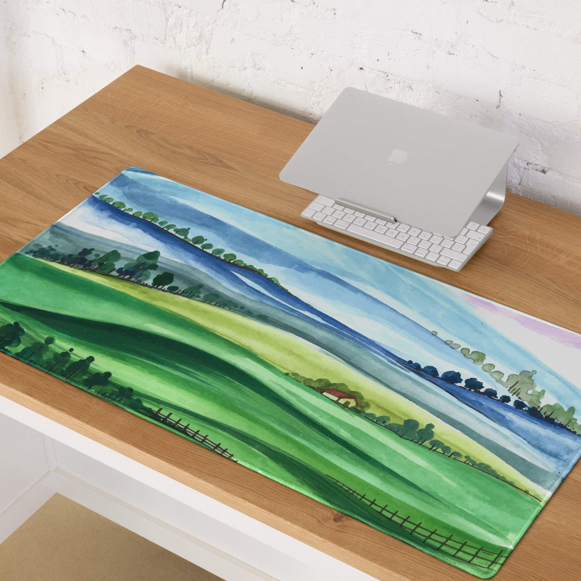 Watercolor landscape gaming mouse pad with green hills, blue sky, red house