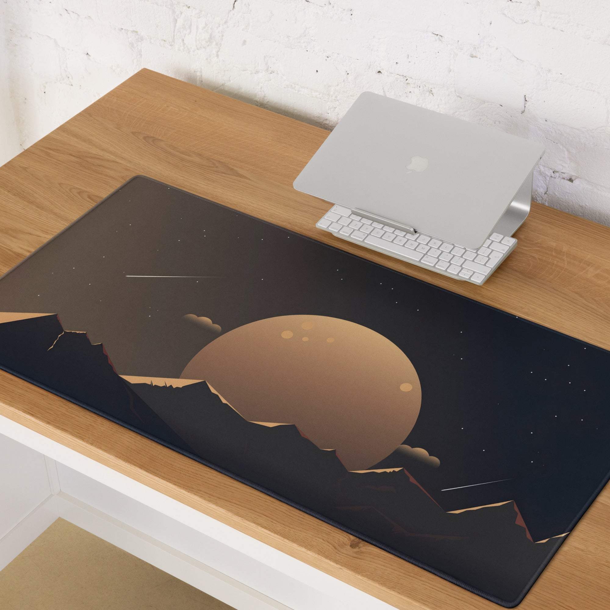 Black gaming mouse pad with golden planet over starry mountains