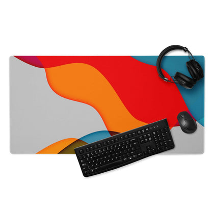 Vibrant abstract wave mouse pad in red orange teal on gray non-slip base